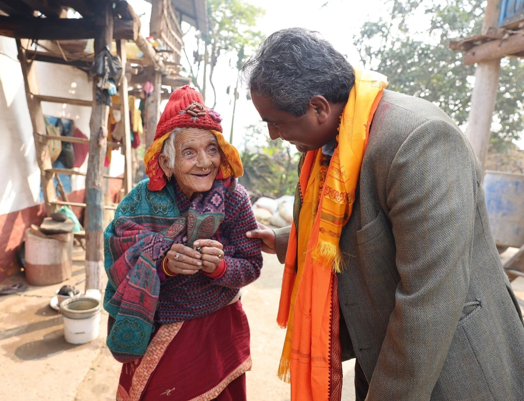 Prabhu Sah with elderly constituent